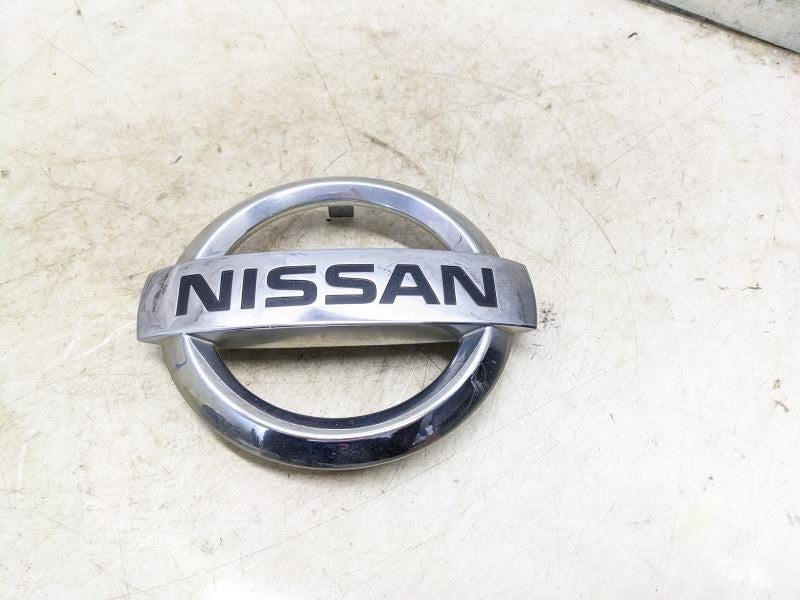 2011-2018 Nissan Rogue Front Grille Chrome Logo 628891JA0A OEM - Alshned Auto Parts